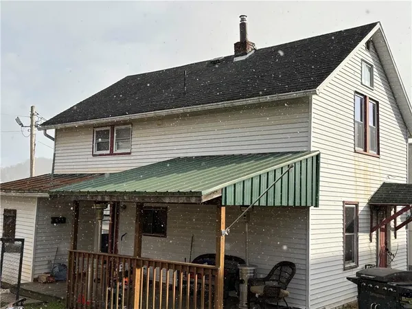 a front view of a house with garage