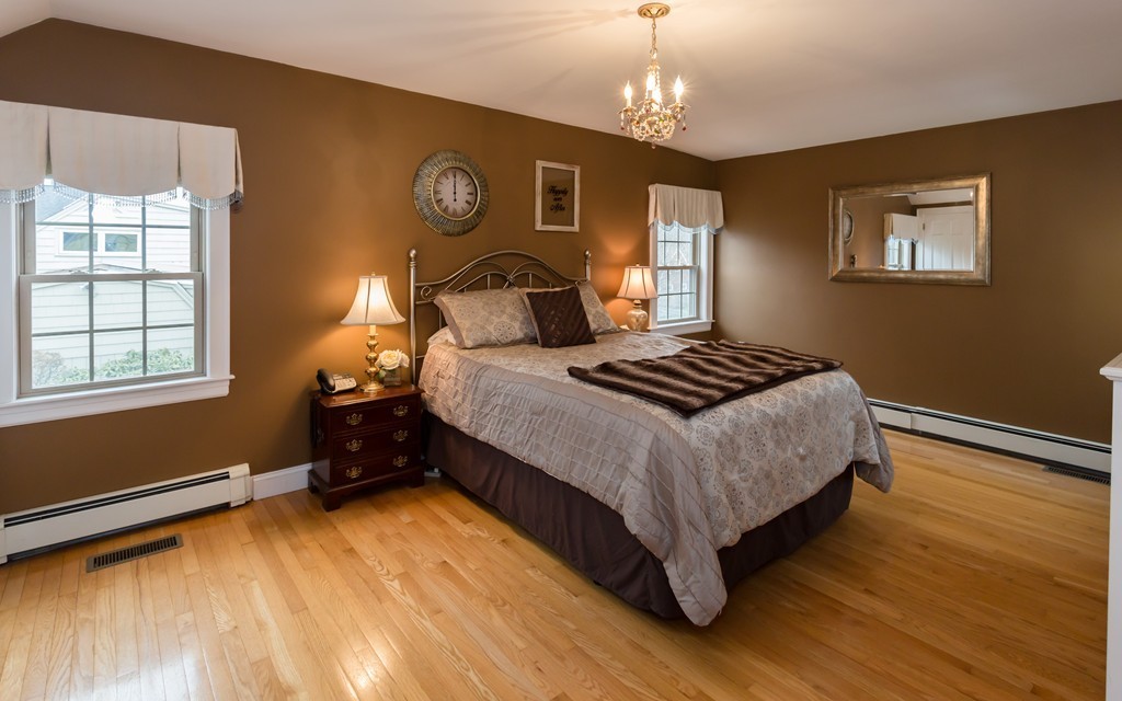 23 Mayflower Road Needham, MA 02492 - Photo 11 of 17 a bedroom with a bed and a window