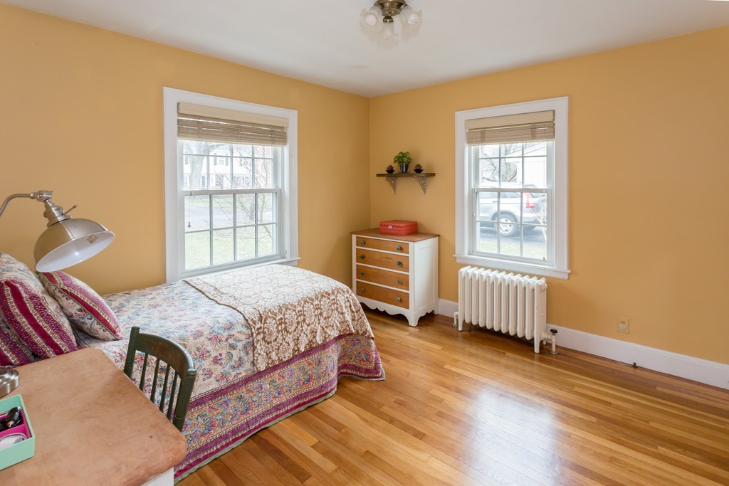 23 Mayflower Road Needham, MA 02492 - Photo 5 of 17 a bedroom with a bed and a window