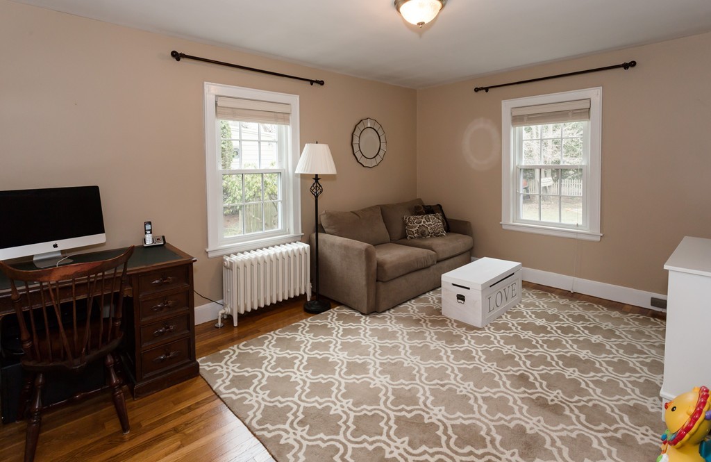 23 Mayflower Road Needham, MA 02492 - Photo 7 of 17 a living room with furniture and a flat screen tv