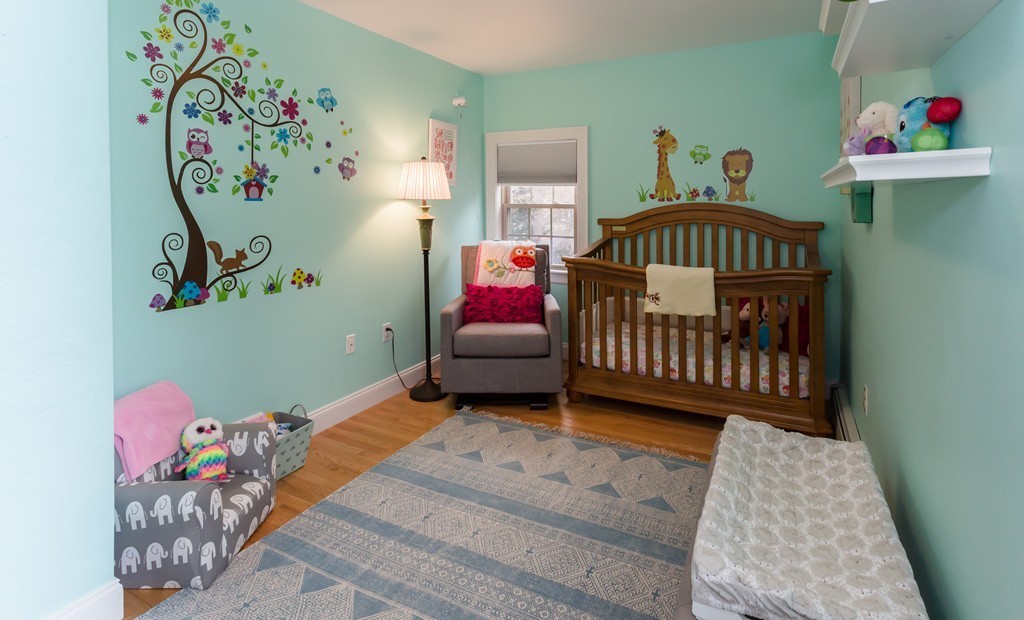 23 Mayflower Road Needham, MA 02492 - Photo 9 of 17 a bedroom with a bed and a white bath tub