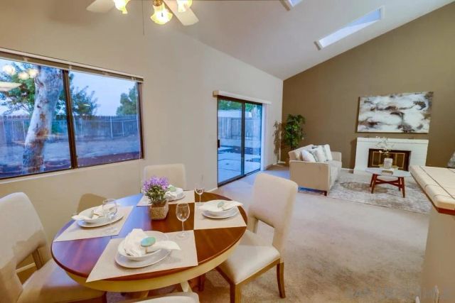 a living room with furniture and fireplace