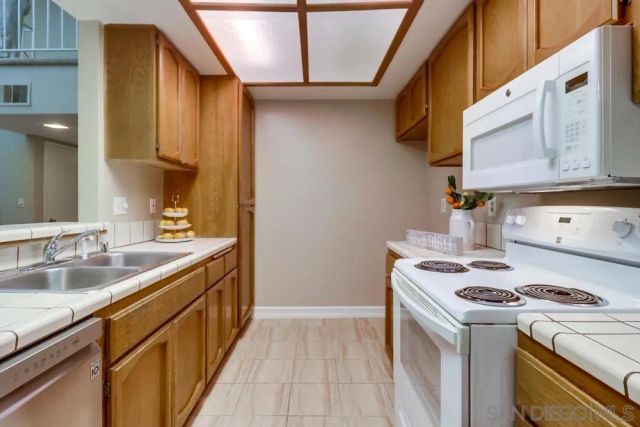 a kitchen with a stove and a sink