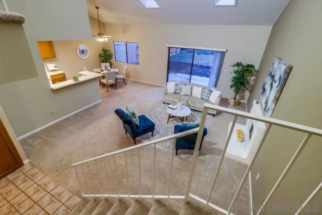 a living room with furniture and a table