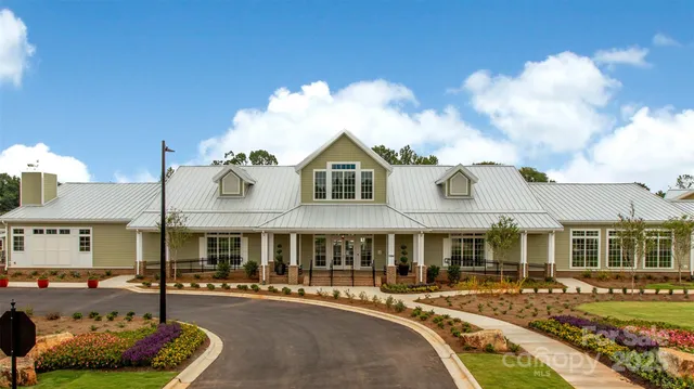 a front view of a residential apartment building with a yard