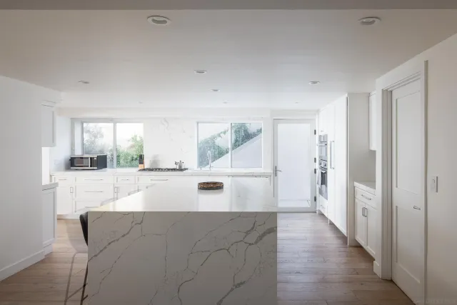 a view of kitchen with furniture and wooden floor