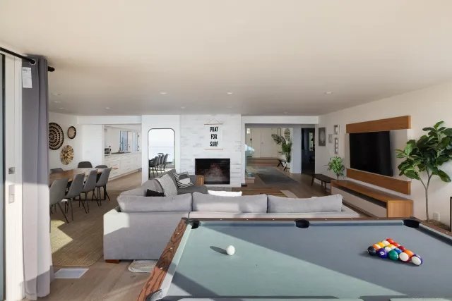 a living room with fireplace furniture and a flat screen tv