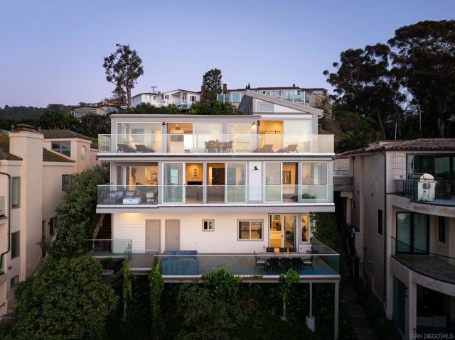 a front view of a house with a ocean view