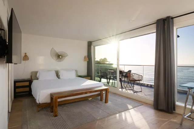 a bedroom with a bed and large window