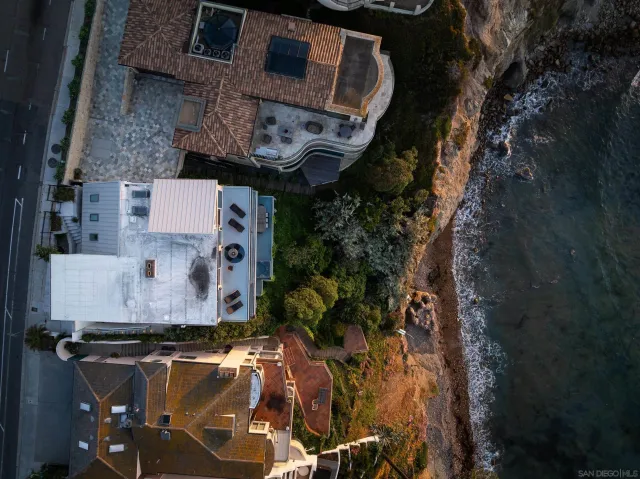 a buildings covered with tall trees