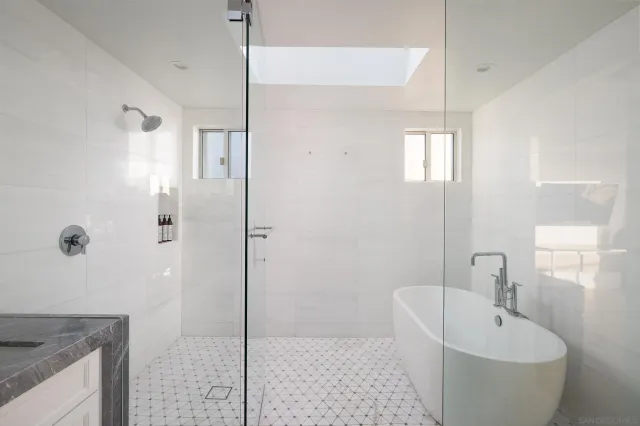 a bath room with a sink and a mirror
