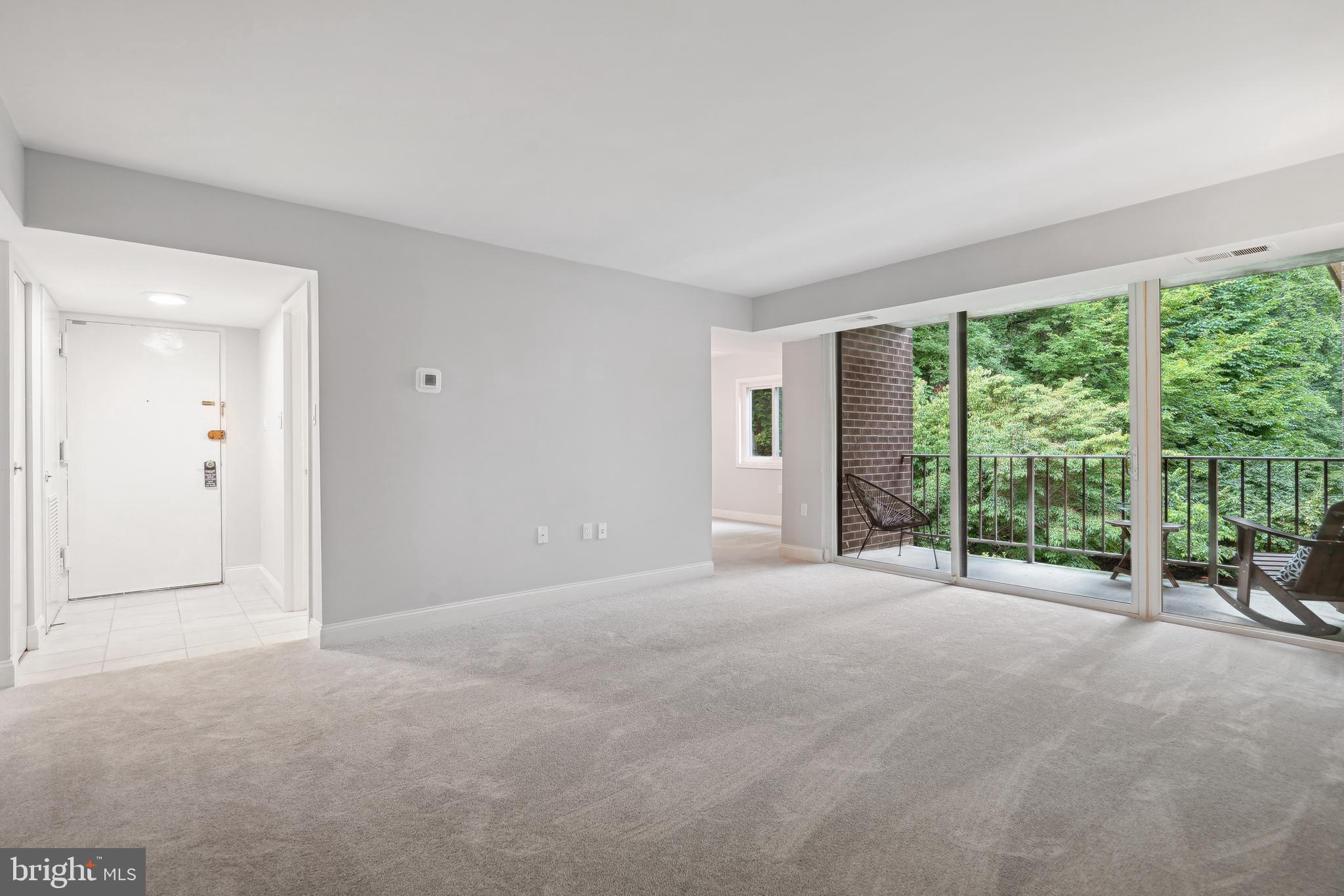 1525 Northgate Square, Unit 12C Reston, VA 20190 - Photo 3 of 23 Living Room Balcony opens to Greenspace