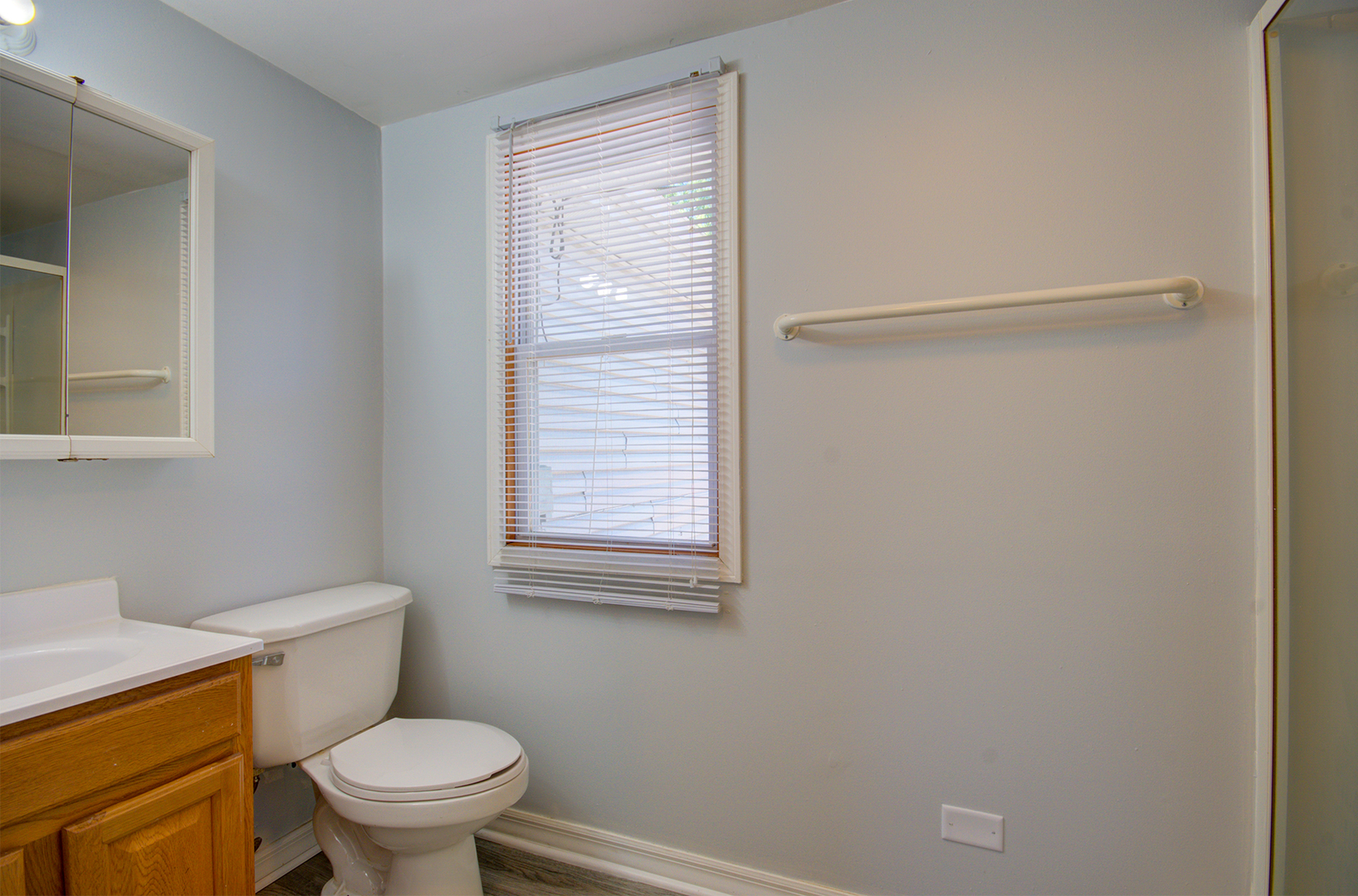 2024 Plainfield Road Crest Hill, IL 60403 - Photo 11 of 20 a white toilet sitting next to a window