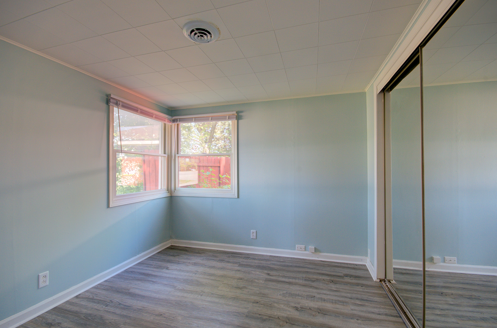 2024 Plainfield Road Crest Hill, IL 60403 - Photo 13 of 20 a view of an empty room with wooden floor and a window