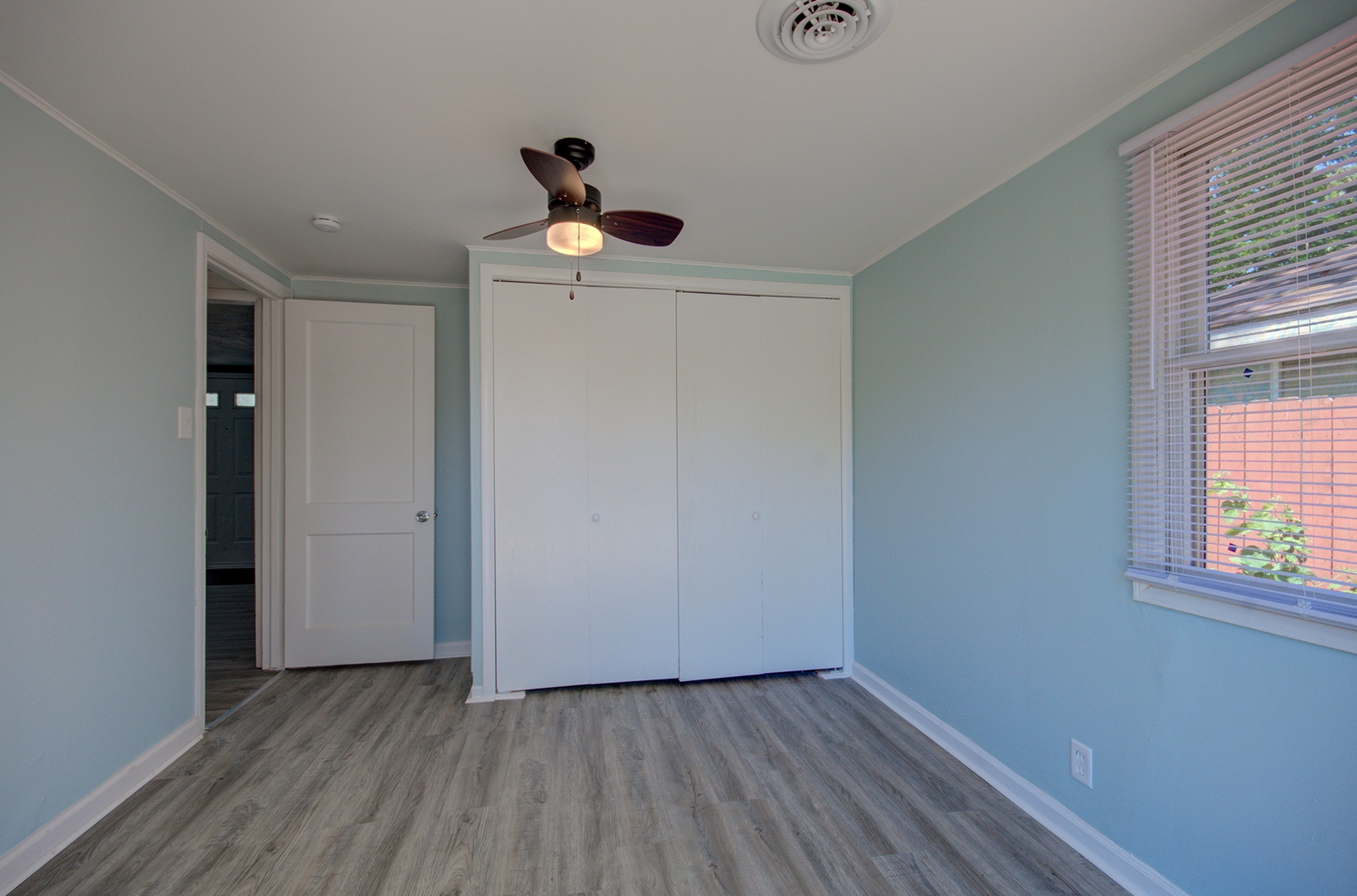 2024 Plainfield Road Crest Hill, IL 60403 - Photo 15 of 20 a view of an empty room with window and wooden floor
