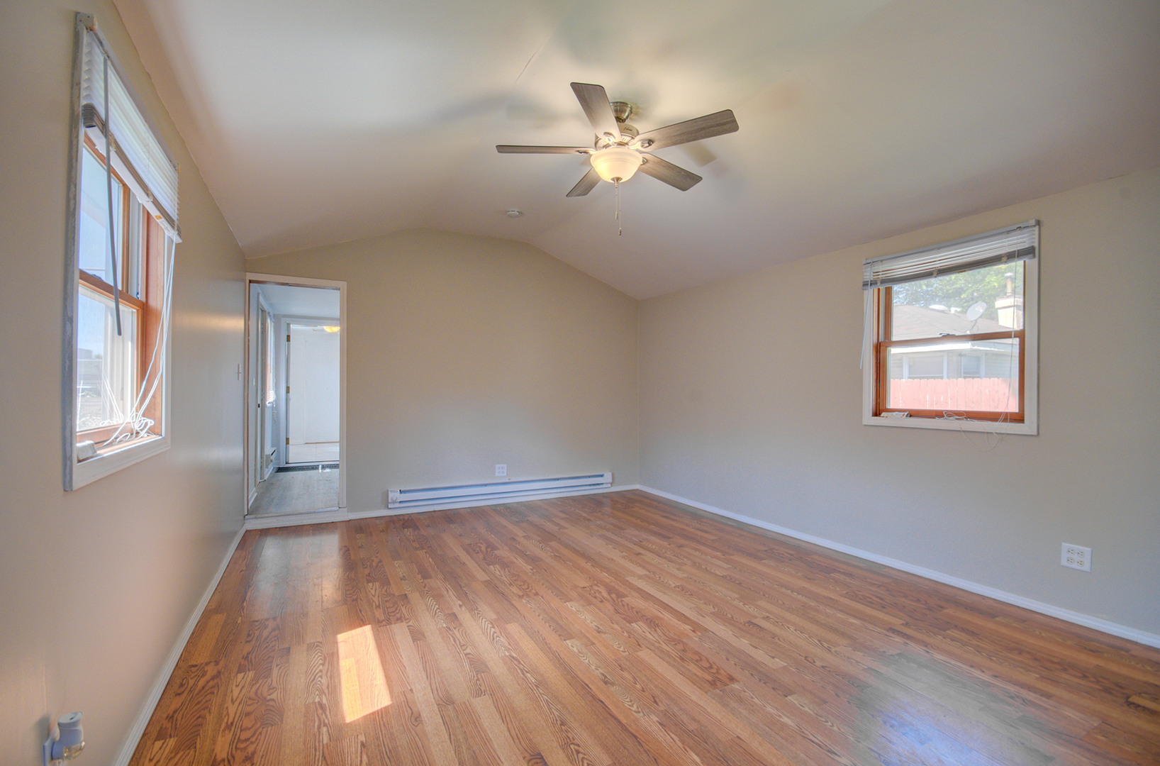 2024 Plainfield Road Crest Hill, IL 60403 - Photo 3 of 20 a view of an empty room with wooden floor and a window