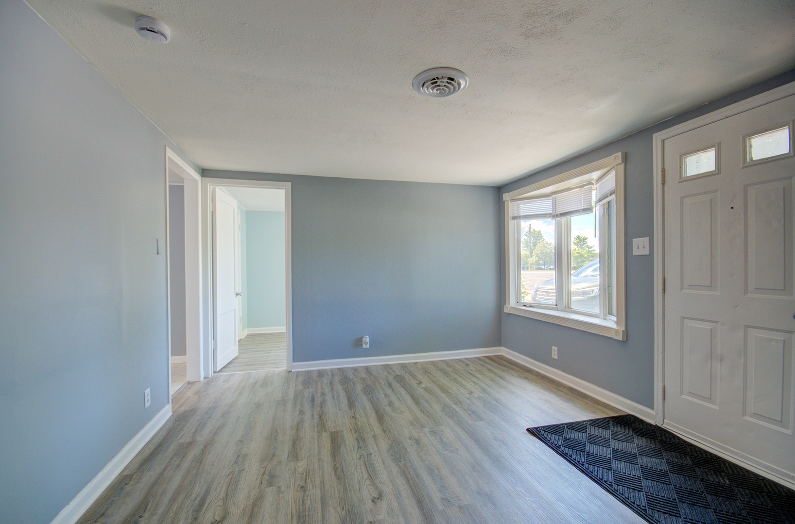 2024 Plainfield Road Crest Hill, IL 60403 - Photo 5 of 20 an empty room with wooden floor and windows