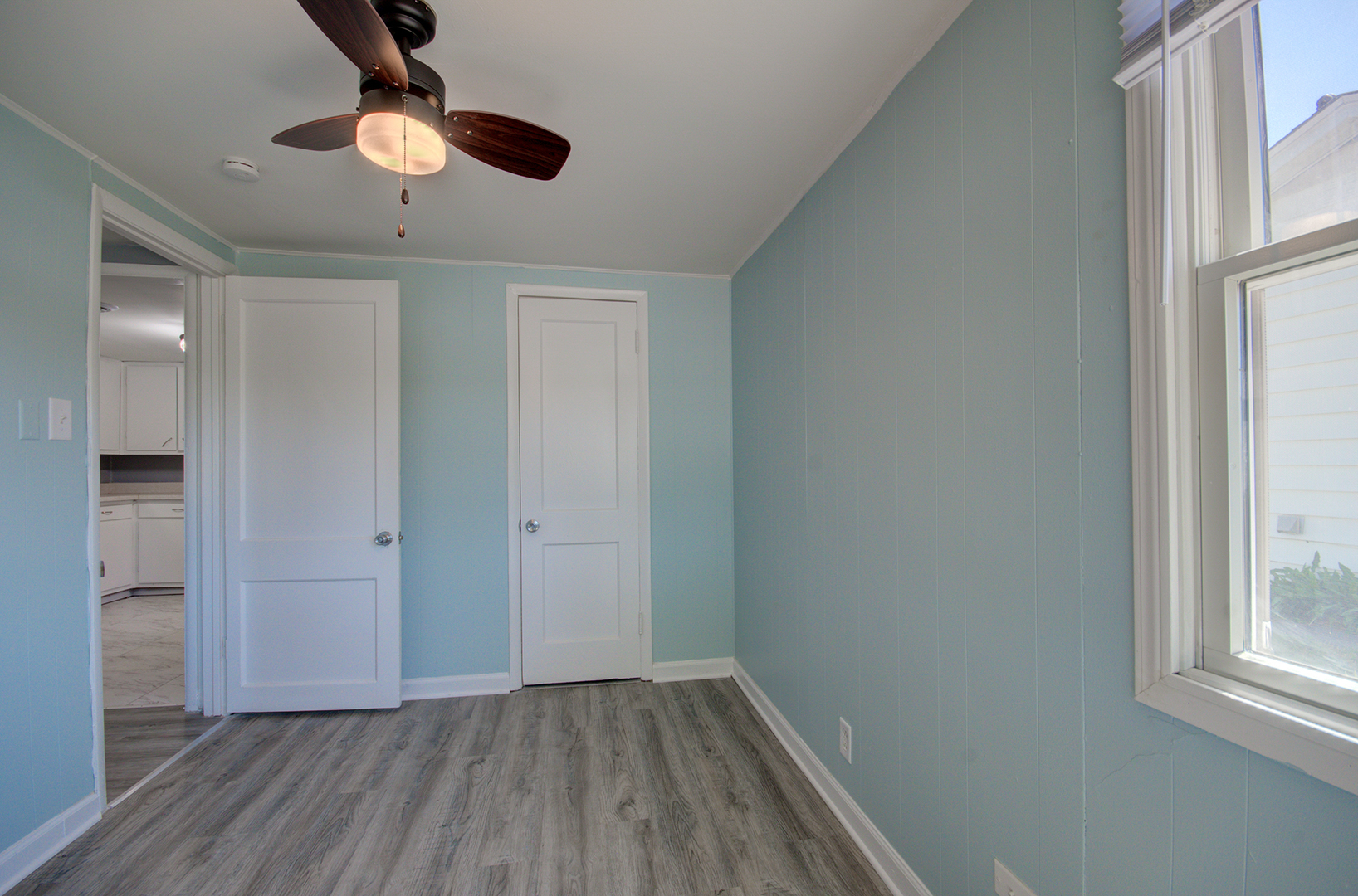2024 Plainfield Road Crest Hill, IL 60403 - Photo 7 of 20 wooden floor in an empty room with a window