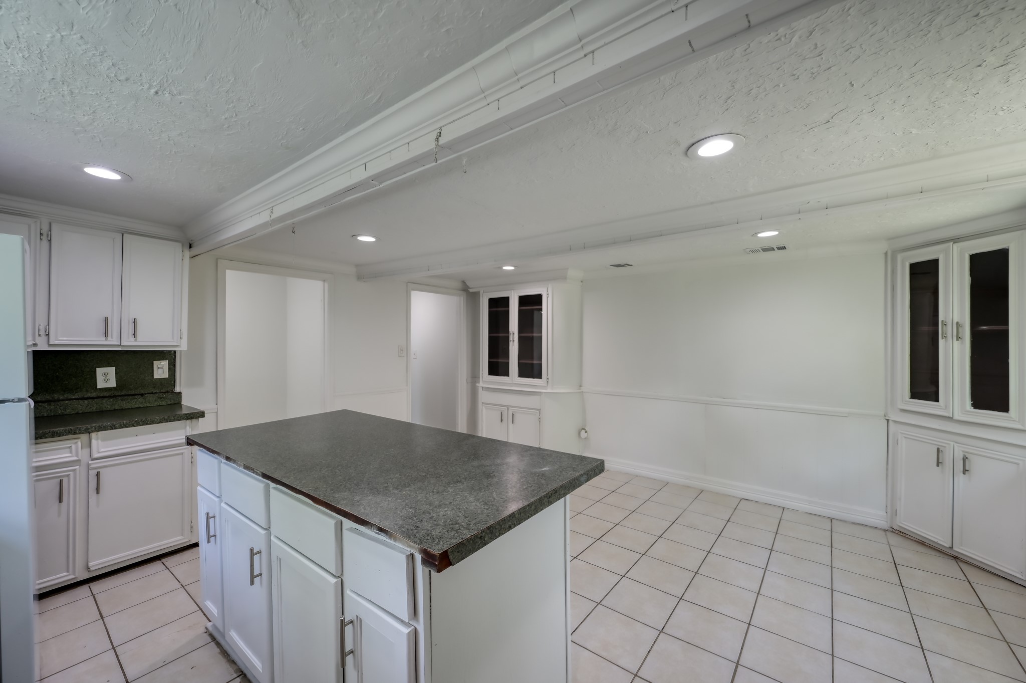 29906 Hunters, Unit B Magnolia, TX 77355 - Photo 12 of 25 a kitchen with a sink a microwave and cabinets