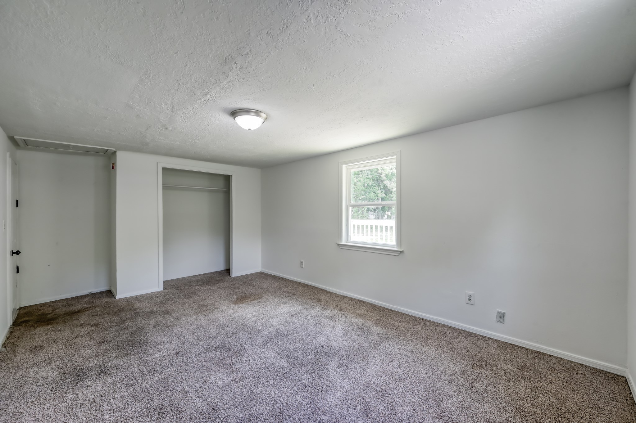 29906 Hunters, Unit B Magnolia, TX 77355 - Photo 14 of 25 an empty room with a empty space and windows