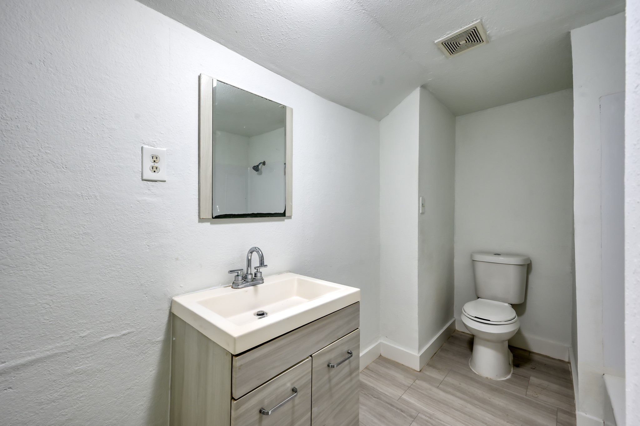 29906 Hunters, Unit B Magnolia, TX 77355 - Photo 16 of 25 a bathroom with a sink toilet and mirror