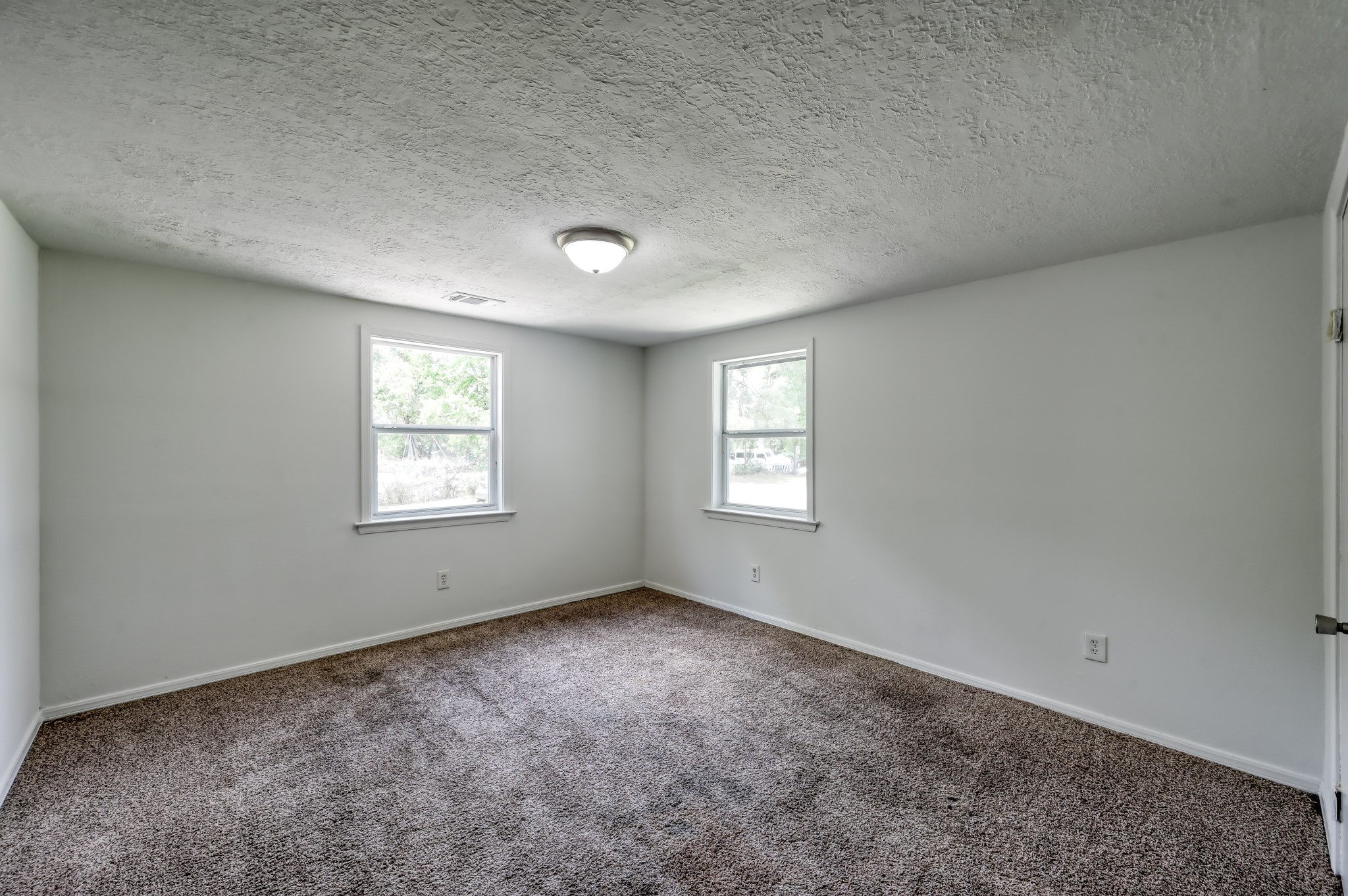29906 Hunters, Unit B Magnolia, TX 77355 - Photo 18 of 25 an empty room with a window