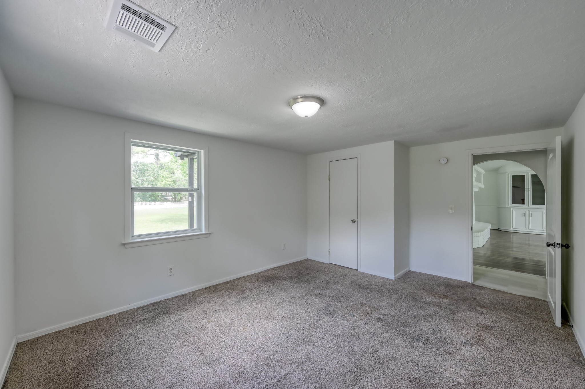 29906 Hunters, Unit B Magnolia, TX 77355 - Photo 19 of 25 a view of an empty room with a window