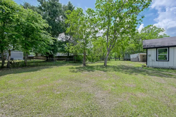 a backyard of a house with lots of green space