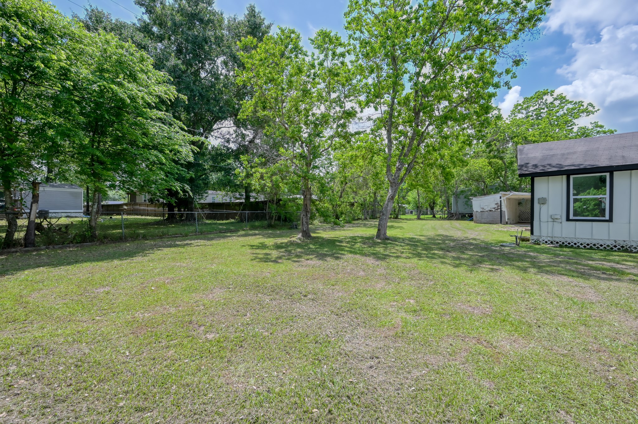 29906 Hunters, Unit B Magnolia, TX 77355 - Photo 23 of 25 a backyard of a house with lots of green space