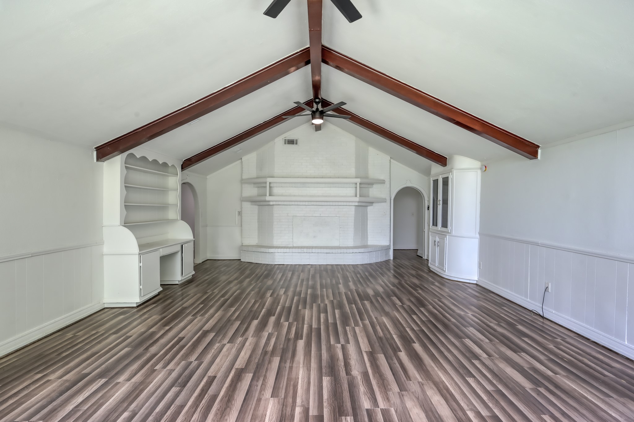 29906 Hunters, Unit B Magnolia, TX 77355 - Photo 4 of 25 a view of a hallway with wooden floor and staircase