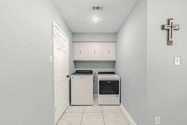 a kitchen with a stove top oven and cabinets