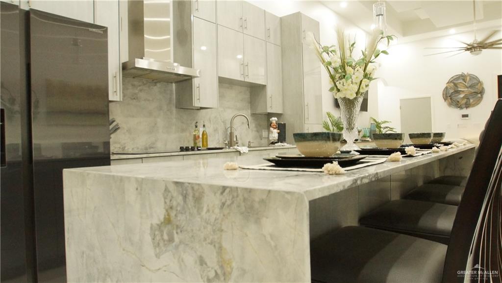 414 Ric Mar Street Edinburg, TX 78541 - Photo 17 of 36 Waterfall countertop island with integrated seating