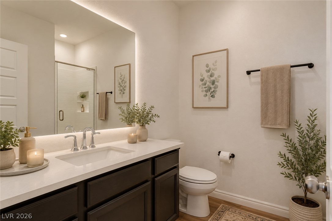 7330 North Decatur Boulevard, Unit 6 North Las Vegas, NV 89084 - Photo 14 of 42 Modern vanity with ample storage and bright, integrated mirror lighting completes this well-appointed bathroom.