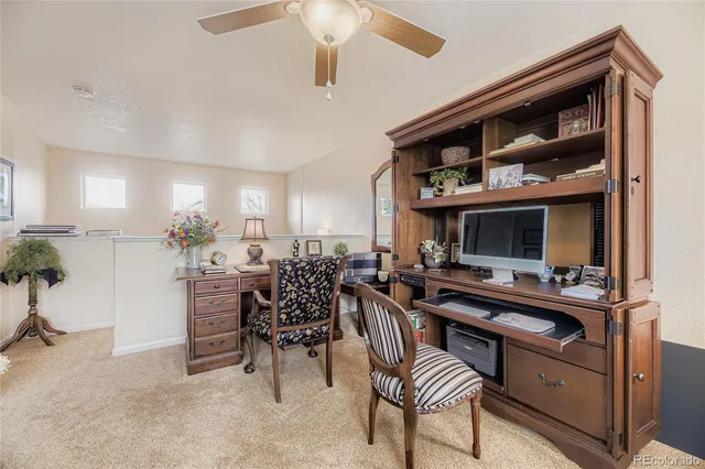 a view of a workspace and kitchen
