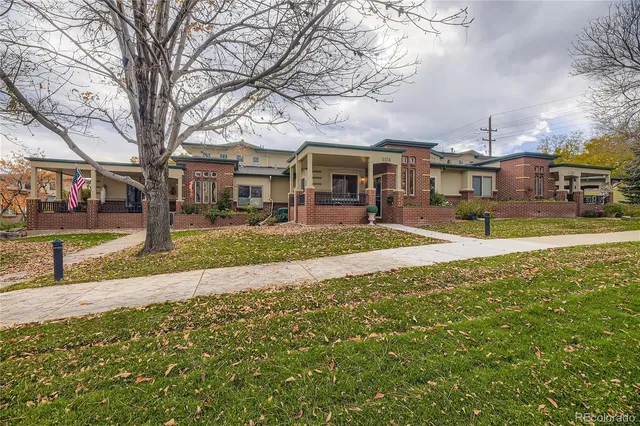 a front view of a building with garden