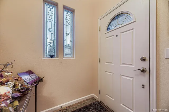a view of a hallway with front door
