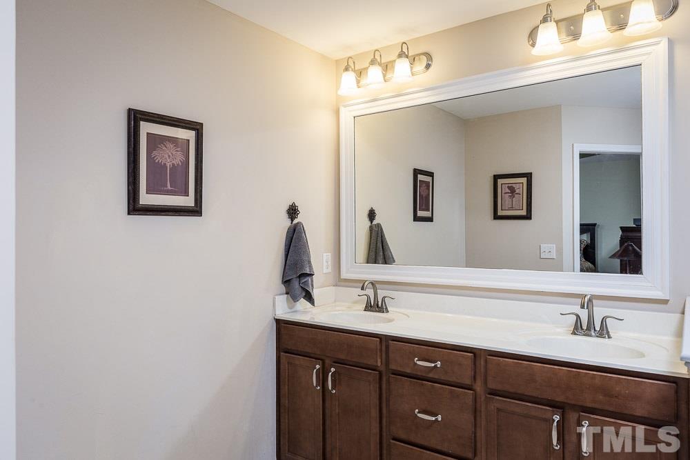 1310 Still Monument Way Raleigh, NC 27603 - Photo 15 of 27 Dual sinks and abundant vanity storage . . . look for the large linen closet too!