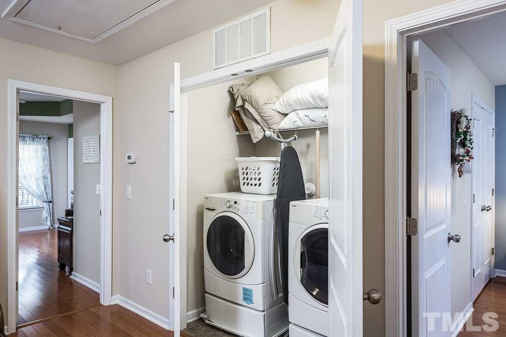 1310 Still Monument Way Raleigh, NC 27603 - Photo 17 of 27 Conveniently located between the bedrooms in the spacious landing - note the hardwoods throughout the upstairs!
