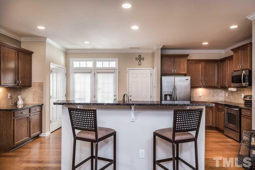 This island and bar will be the central gathering spot for everyone and you'll be able to oversee the room with ease!