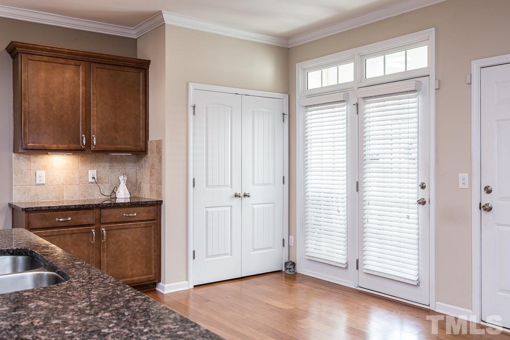 1310 Still Monument Way Raleigh, NC 27603 - Photo 9 of 27 A food pantry with double doors AND a butler's pantry for your bar or coffee station!
