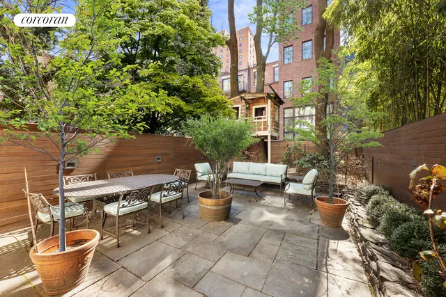 a kitchen with granite countertop wooden cabinets and stainless steel appliances