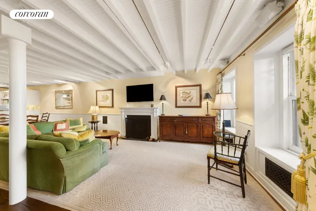 a kitchen with a table chairs stove and cabinets