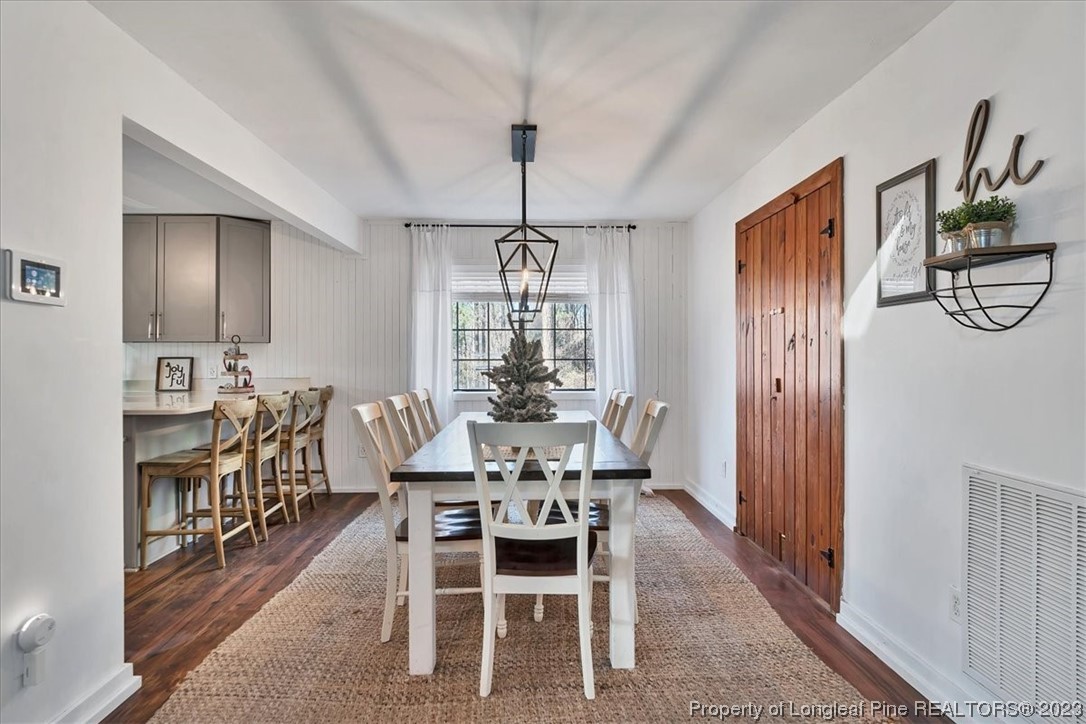 8199 Calloway Road Aberdeen, NC 28315 - Photo 18 of 50 a dining room with furniture window and wooden floor