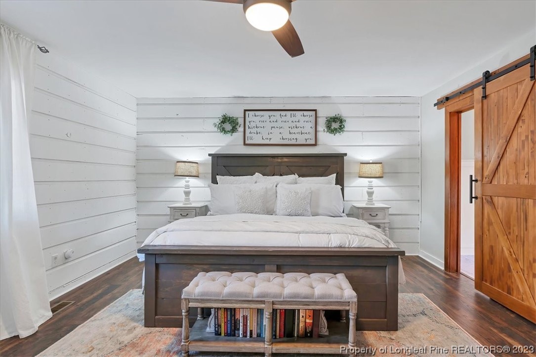8199 Calloway Road Aberdeen, NC 28315 - Photo 20 of 50 a bed sitting in a bedroom next to a window