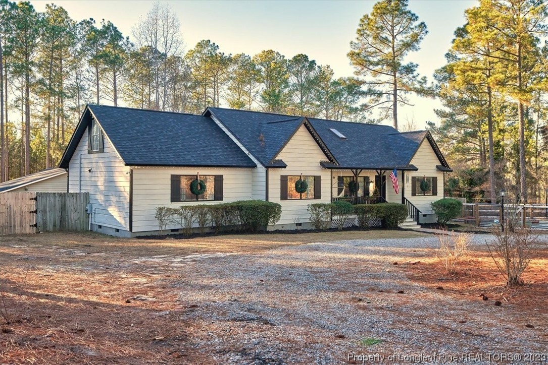8199 Calloway Road Aberdeen, NC 28315 - Photo 2 of 50 a front view of a house with a garden