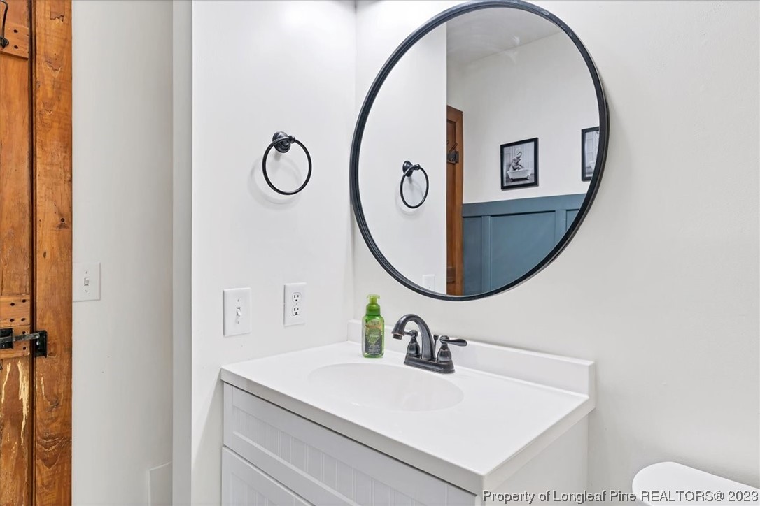 8199 Calloway Road Aberdeen, NC 28315 - Photo 29 of 50 a bathroom with a sink and a mirror