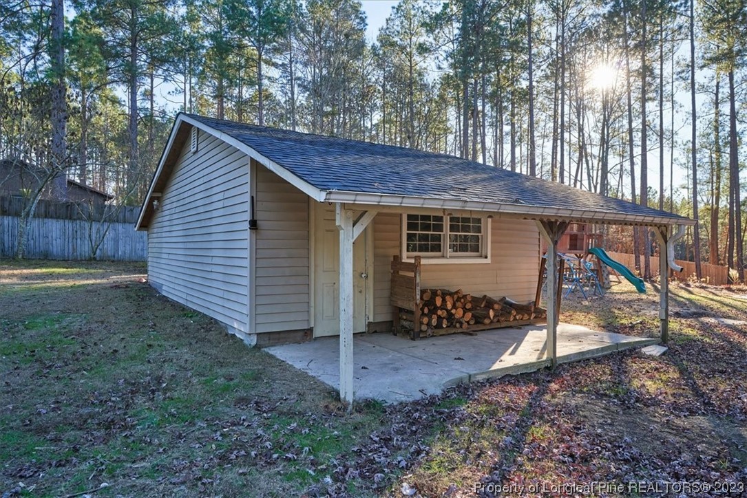 8199 Calloway Road Aberdeen, NC 28315 - Photo 43 of 50 a view of a house with yard and a tree