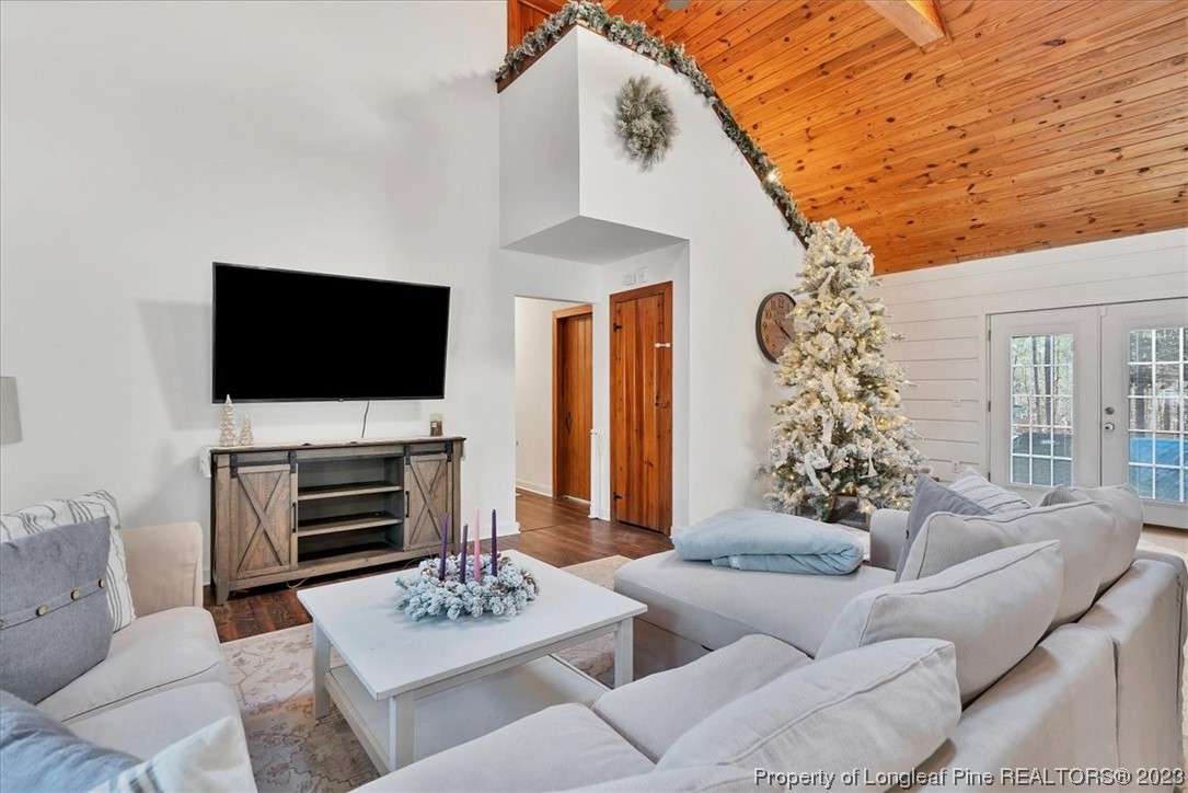 8199 Calloway Road Aberdeen, NC 28315 - Photo 10 of 50 a living room with furniture a flat screen tv and a fireplace