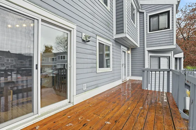 a view of a house with wooden fence