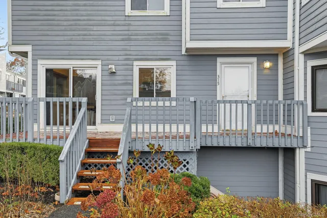a house with swimming pool in front of it